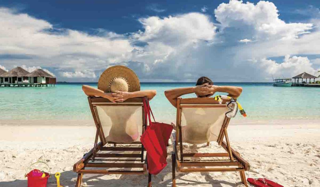 Happy couple on beach chairs in Costa Rica